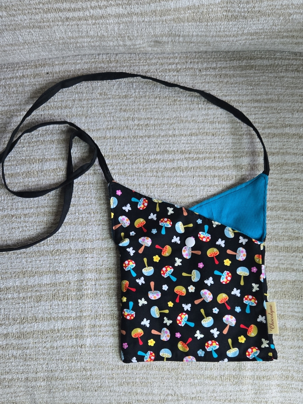 Black Mushroom Crossbody Bag with Blue Accent